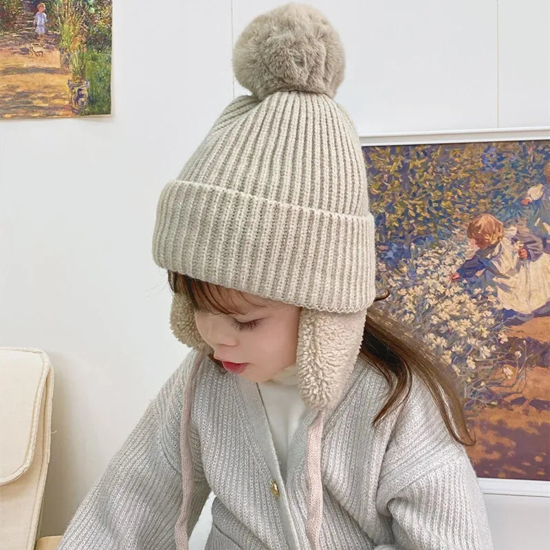 Plush-Lined Toddler Winter Cap with Chin Tie and Ear Covers – Warm Knitted Cold-Weather Headwear for Boys and Girls Age 2-8 | Thomler