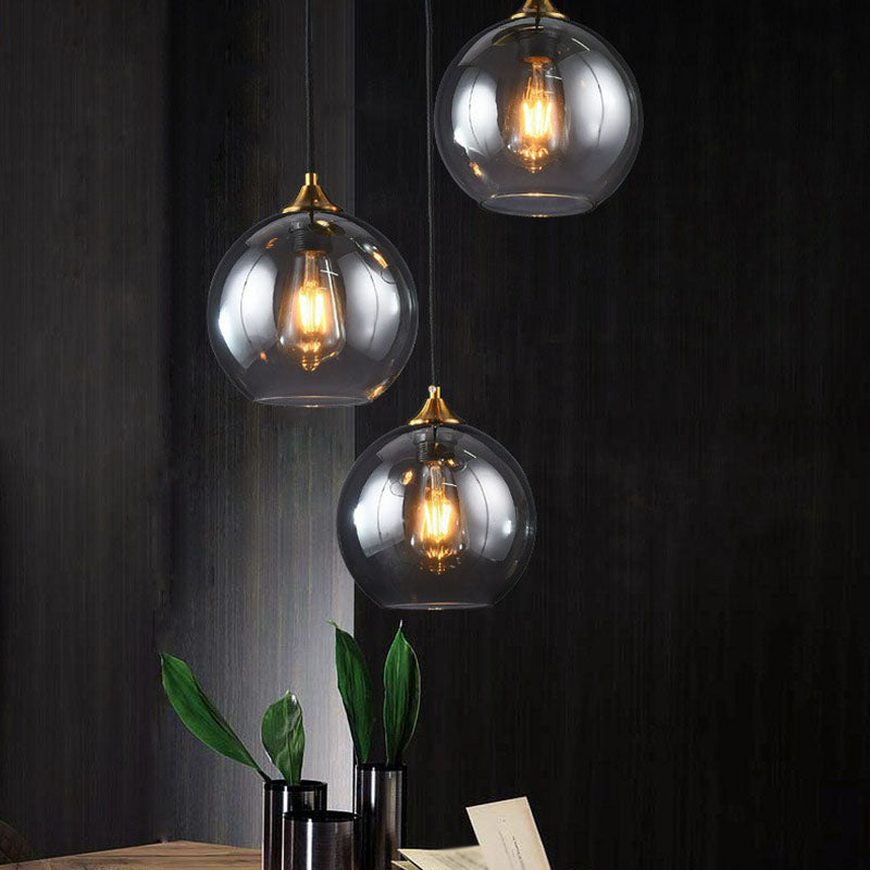 Three-Light Hanging Ceiling Fixture with Tapered Glass Globes in Antique Brass Finish for Dining Room Kitchen Island | Thomler