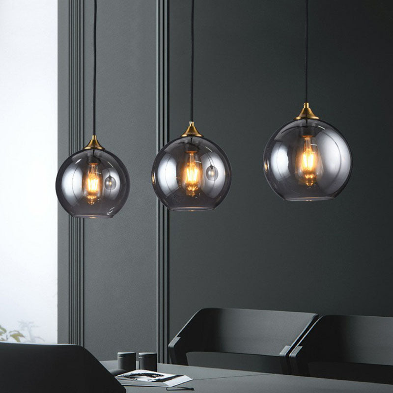 Three-Light Hanging Ceiling Fixture with Tapered Glass Globes in Antique Brass Finish for Dining Room Kitchen Island | Thomler