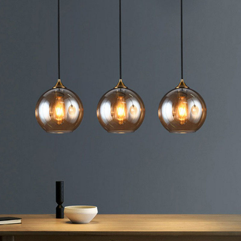 Three-Light Hanging Ceiling Fixture with Tapered Glass Globes in Antique Brass Finish for Dining Room Kitchen Island | Thomler
