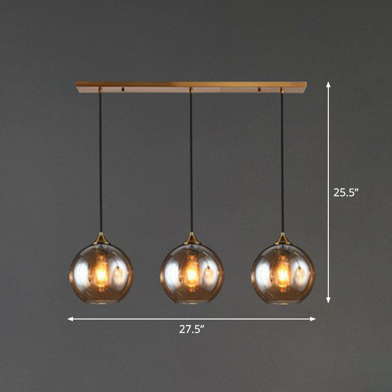 Three-Light Hanging Ceiling Fixture with Tapered Glass Globes in Antique Brass Finish for Dining Room Kitchen Island | Thomler