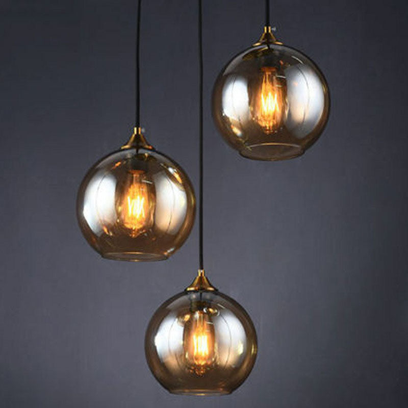 Three-Light Hanging Ceiling Fixture with Tapered Glass Globes in Antique Brass Finish for Dining Room Kitchen Island | Thomler