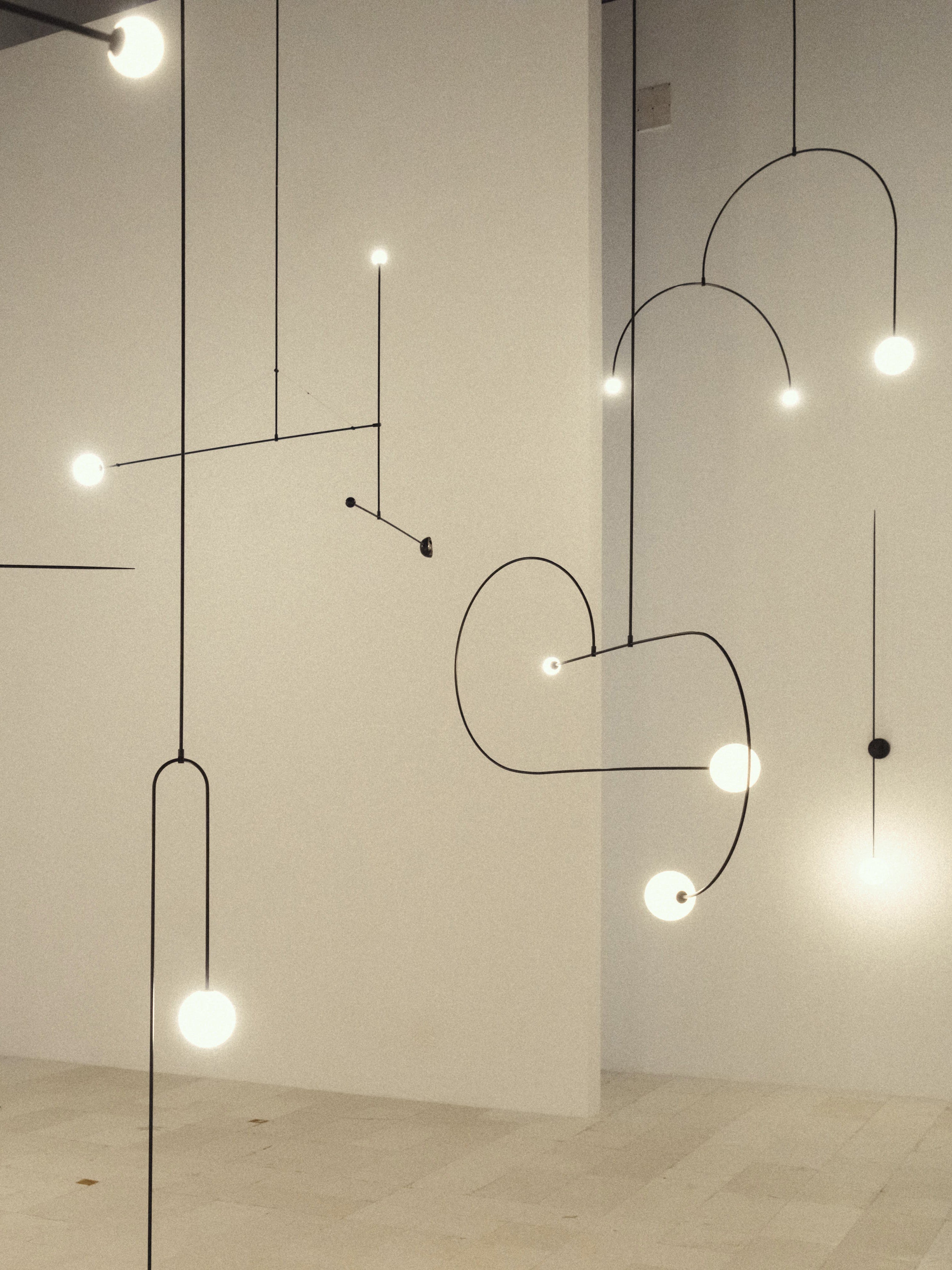 Mobile Chandelier 55.1 in L x 33.5 in H Patinated Brass Black Modern Living Room Ceiling Light Minimalist Glass Diffuser Fixture | Thomler
