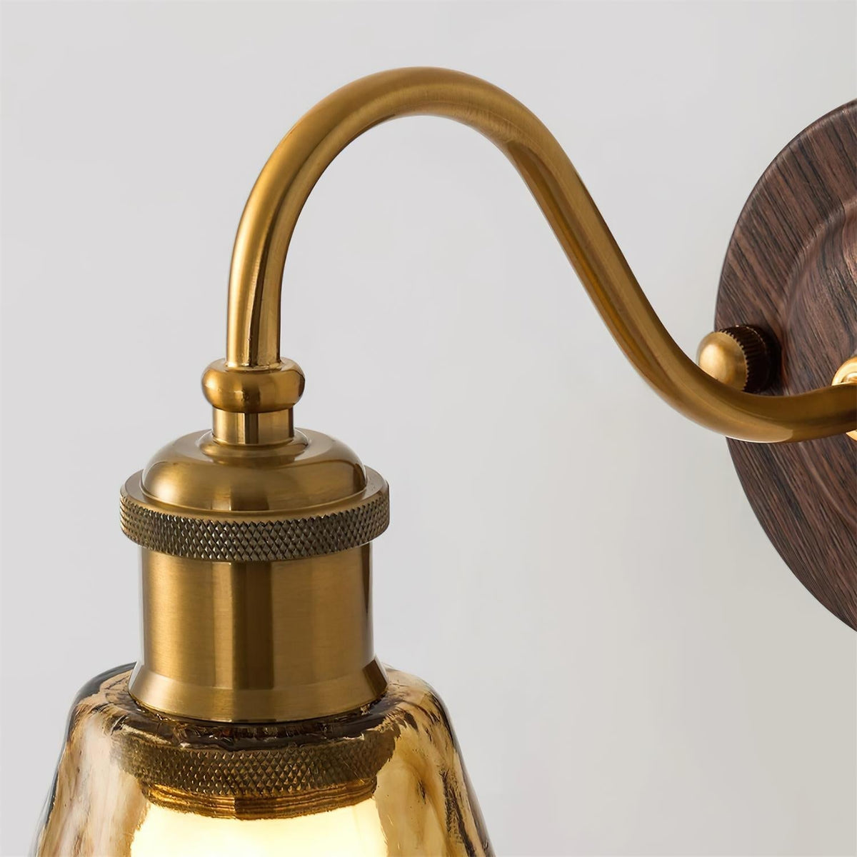 Vintage Amber Glass Wall Sconce with Wood-Tone Finish and Brass Accents | Thomler
