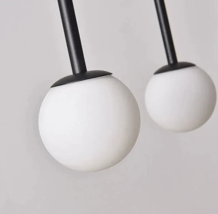 Contemporary Frosted Globe Chandelier with Curved Metal Arms – Modern Statement Lighting for Dining Room & Entryway | Thomler