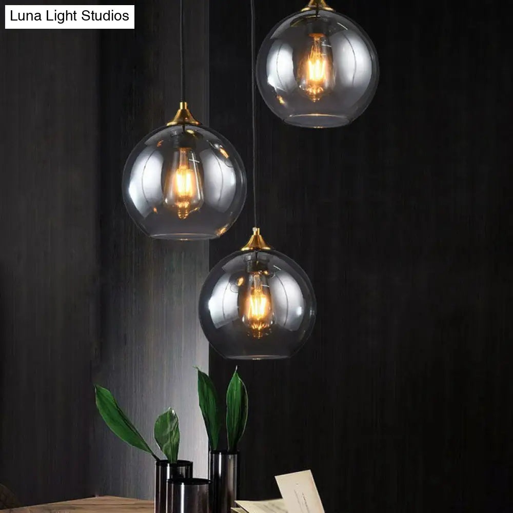 Three-Light Hanging Ceiling Fixture with Tapered Glass Globes in Antique Brass Finish for Dining Room Kitchen Island | Thomler