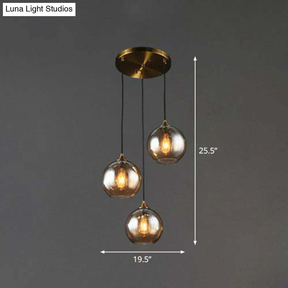 Three-Light Hanging Ceiling Fixture with Tapered Glass Globes in Antique Brass Finish for Dining Room Kitchen Island | Thomler