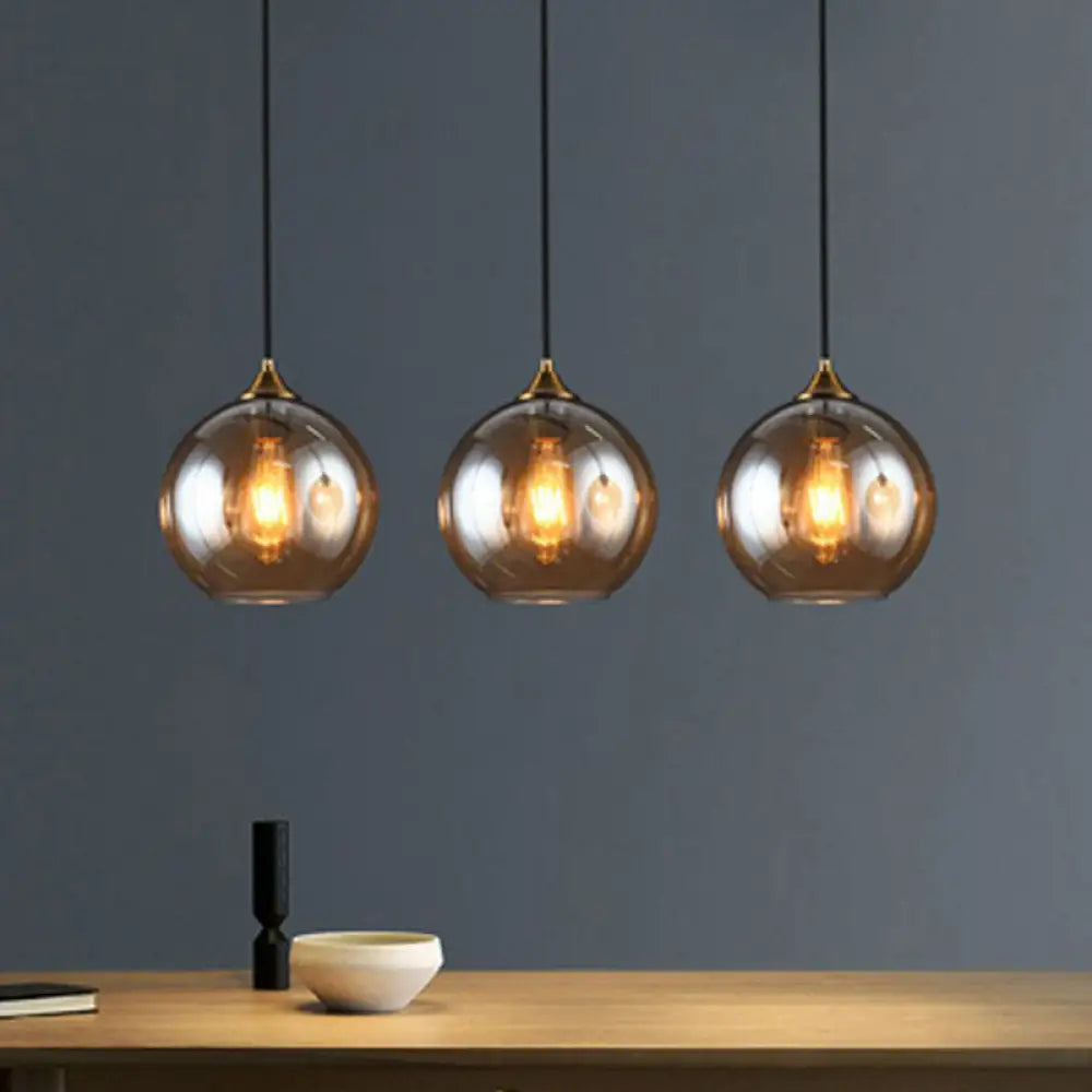Three-Light Hanging Ceiling Fixture with Tapered Glass Globes in Antique Brass Finish for Dining Room Kitchen Island | Thomler