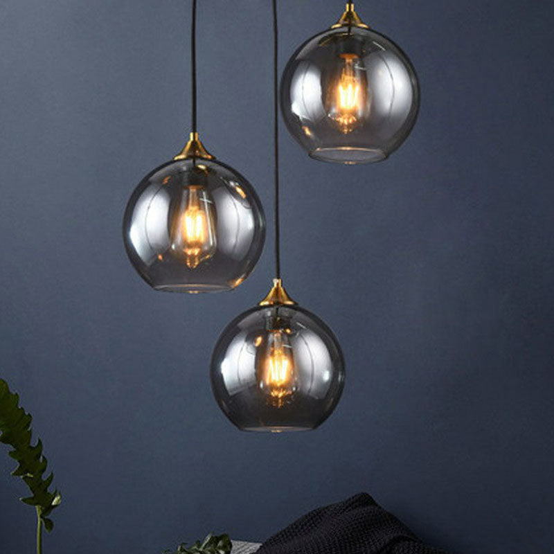 Three-Light Hanging Ceiling Fixture with Tapered Glass Globes in Antique Brass Finish for Dining Room Kitchen Island | Thomler