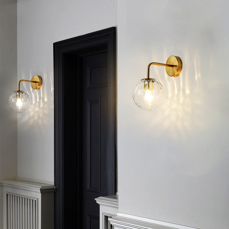 Contemporary Textured Globe Wall Light with Brass Arm | Single-Bulb Sconce for Bedroom, Hallway & Living Room | Hardwired Electric Fixture | Thomler