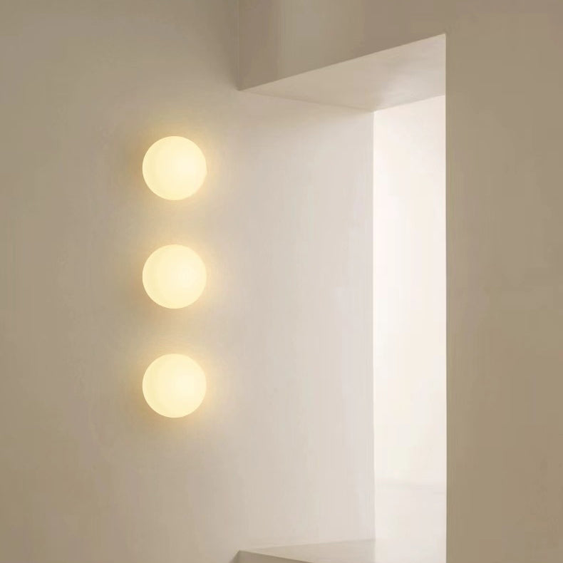 Globe Wall Light Fixture Spherical Shade Bedroom Hallway Ambient Lighting Contemporary Mount Minimal Design Clear Glass Room Accent | Thomler