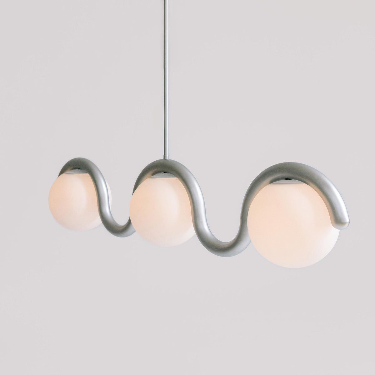 Modern Linear Chandelier with Curved Metal Frame & Glass Sphere – Art Nouveau Pendant Light for Dining Room | Thomler