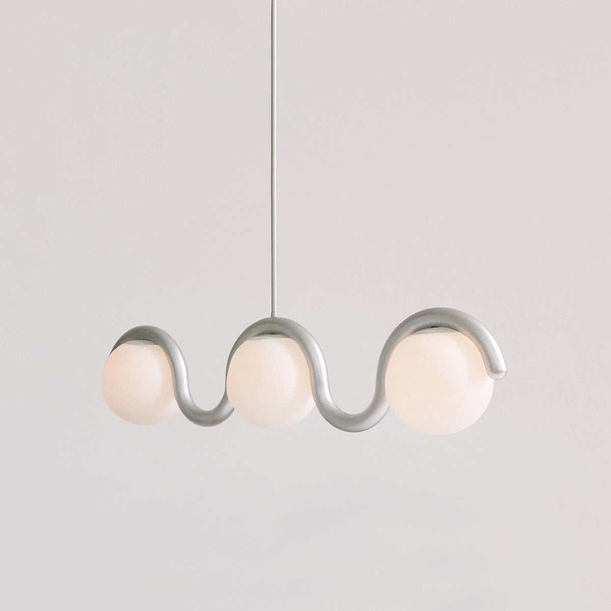 Modern Linear Chandelier with Curved Metal Frame & Glass Sphere – Art Nouveau Pendant Light for Dining Room | Thomler
