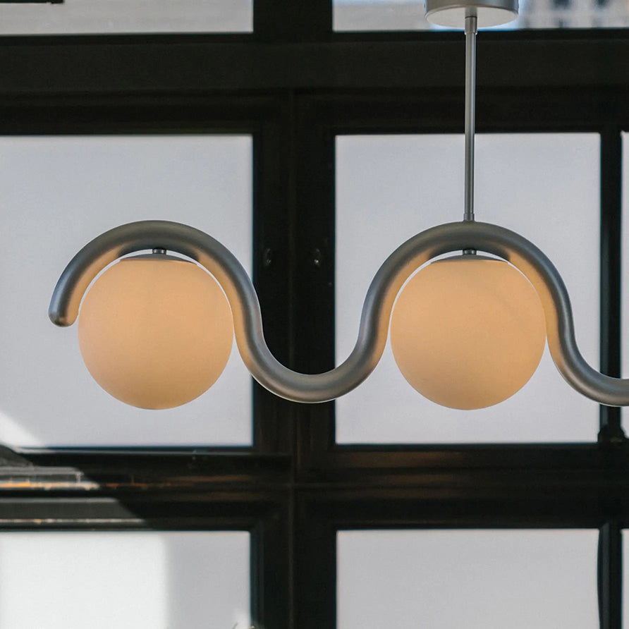 Modern Linear Chandelier with Curved Metal Frame & Glass Sphere – Art Nouveau Pendant Light for Dining Room | Thomler