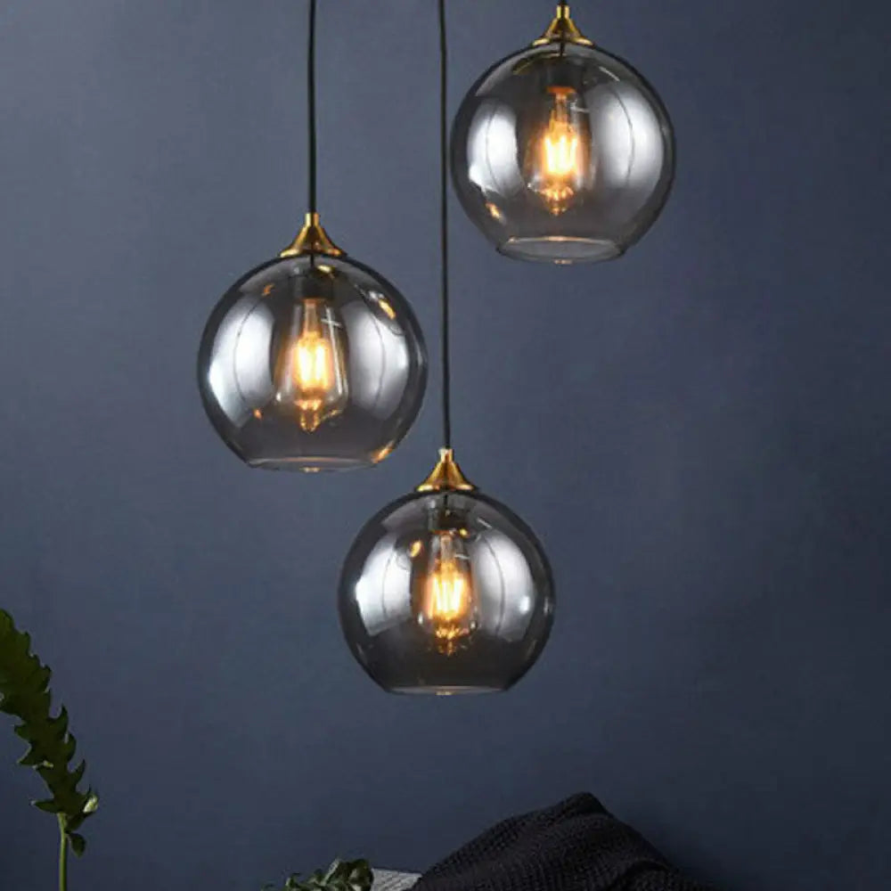 Three-Light Hanging Ceiling Fixture with Tapered Glass Globes in Antique Brass Finish for Dining Room Kitchen Island | Thomler