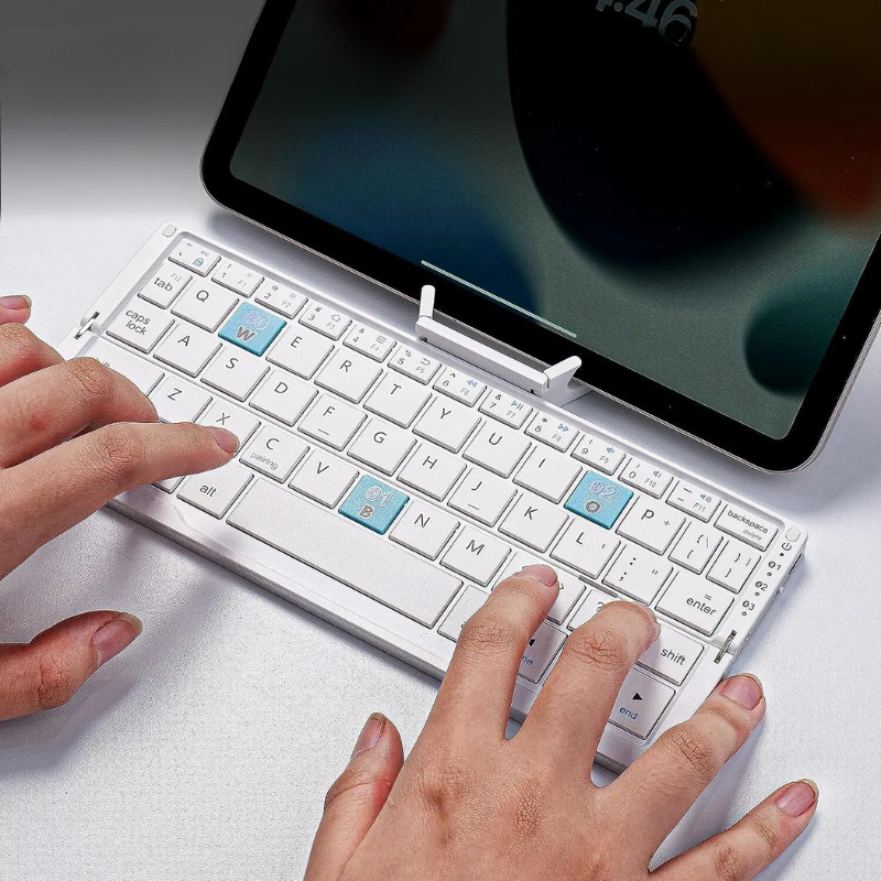 Portable Folding Wireless Keyboard with Integrated Tablet Stand for iPad Android iOS Devices Multi-Device Pairing Rechargeable Travel Typing | Thomler